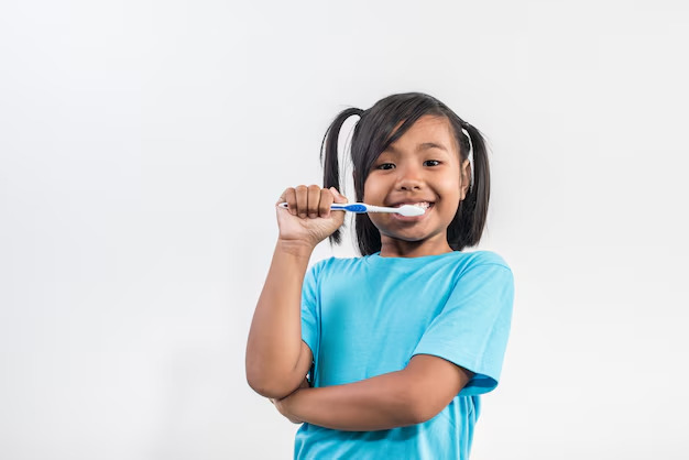 little girl brushing her teeth